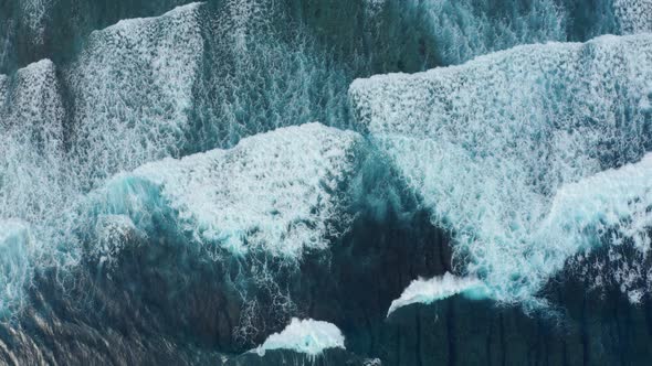 Amazing Blue Ocean Wide Waves Covered with White Foam Aerial alt