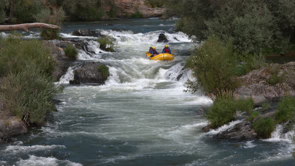 Super slow motion shot of group of people white water rafting, shot on Phantom Flex 4K