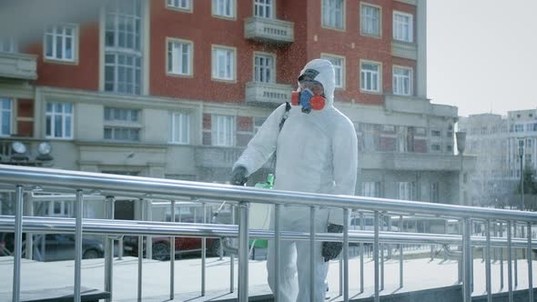 Corona Virus. Man White Protective Chemical Suit Disinfect. Covid-19 Coronavirus alt