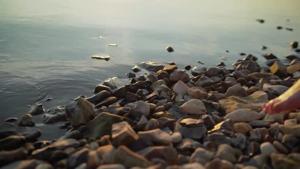 Sexy Legs on the Beach. Walking Female Legs. Close-up of Female Legs on the Pebbles. Beautiful alt