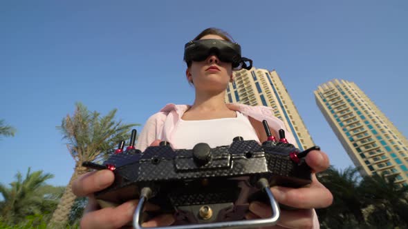 Girl in Virtual Glasses with a Remote Control