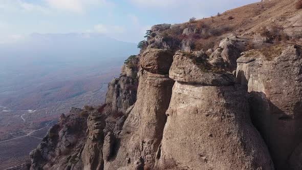 Aerial View of a Drone Flying Over Sharp Rocky Outcrops alt