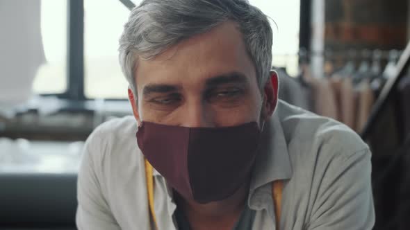 Portrait of Male Tailor in Protective Face Mask alt