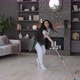 Energetic Happy Young Woman Housewife Mopping Floor in Living Room Performs Choreographic Movements - VideoHive Item for Sale