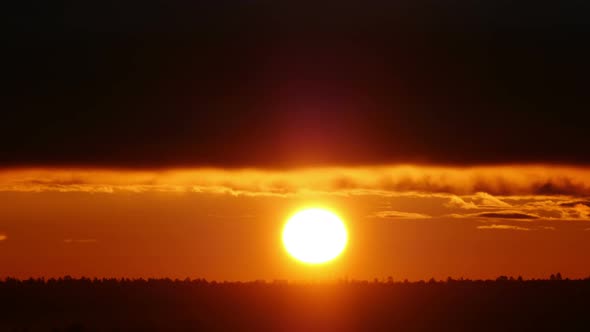 Red Sun Rises Over the Horizon Timelapse alt