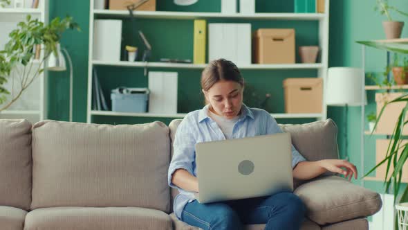 Woman Trying to Sit Comfortably for Relax and Relieve Pain alt