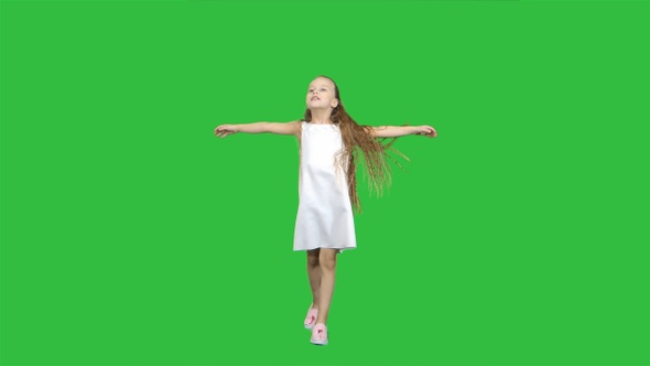 Dancing little blond girl singing on a Green Screen, Chroma Key