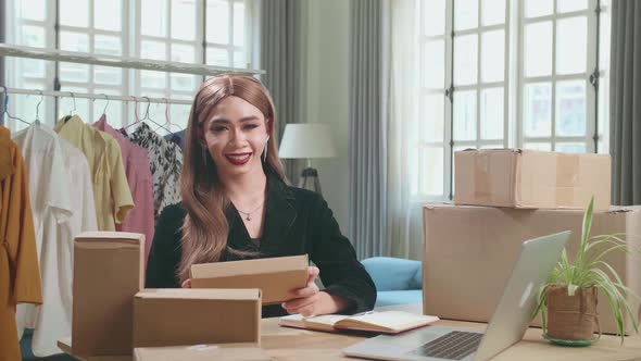 Asian Transgender Woman Business Owner With Boxes, Pose And Smiles To Camera alt