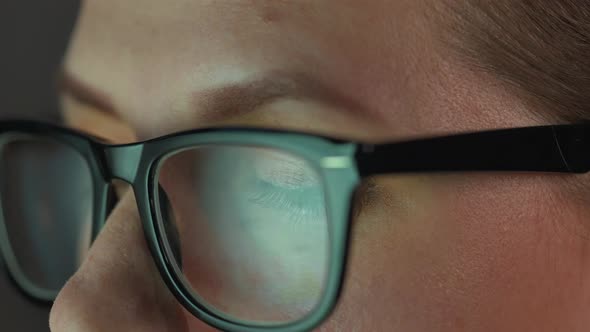 Woman in Glasses Looking on the Monitor and and Working with Charts and Analytics alt