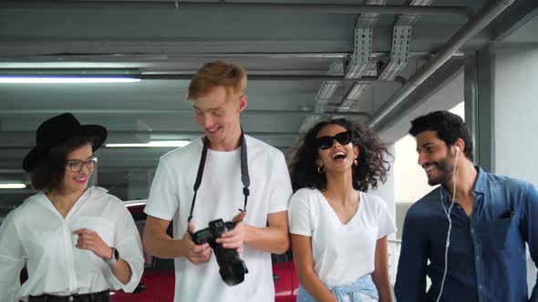 Happy Stylish Friends In Casual Fashionable Clothes At Parking alt