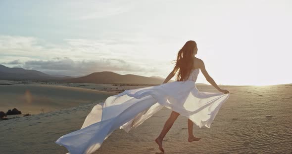 Charismatic Lady with a Long White Dress Running alt
