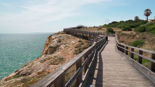 Wonderful View of the Portuguese Coast of Carvoeiro in Summer Walking Along the Wooden Paths alt