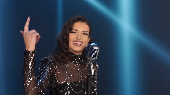 Girl Singing Into a Microphone alt