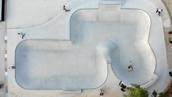Skate park with men riding bicycles alt
