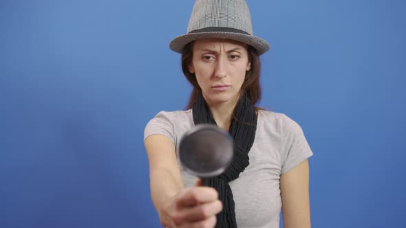 Funny Girl Looking Throw Magnifier To the Camera  alt