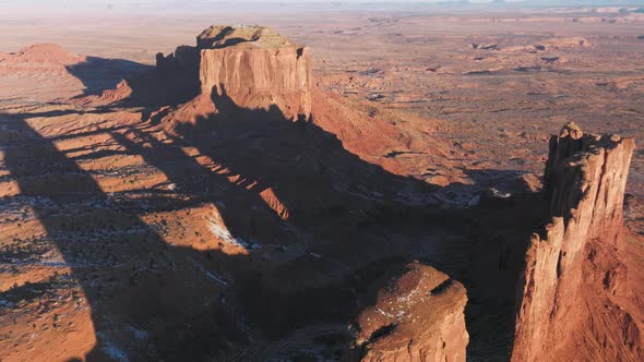 Dramatic Sunrise Light on Red Canyon Cliff Wall Creating Long Cinematic Shadows alt