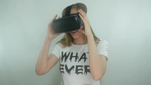 Young Sexy Girl Uses A Virtual Reality Helmet