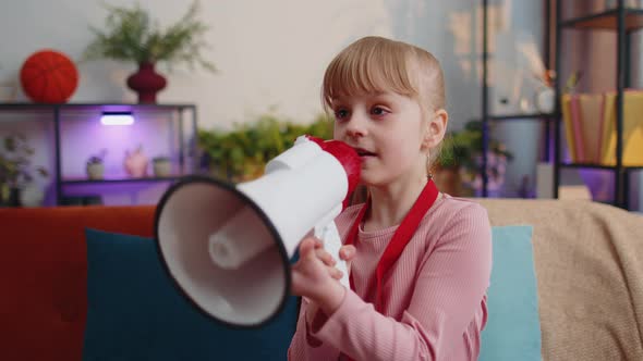 Child Girl Kid Standing on Sofa at Home Alone Loudly Shout in Megaphone Announces Discounts Sale alt