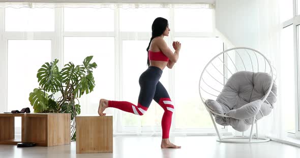Young woman doing sports, fitness at home.