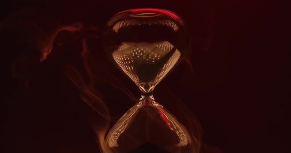 Beautiful smoke rising around hourglass alt