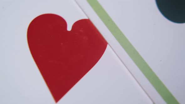 Playing Cards of Different Suits on Light Grey Background alt