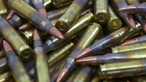 Close Up of Rifle 5.56 Reloaded Ammunition Pile Rotating