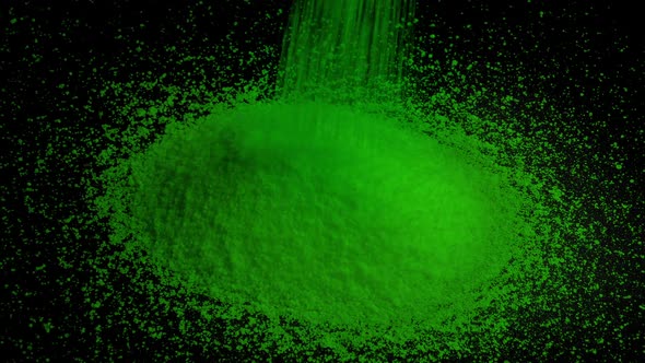 Green Granules Pour Into Pile alt