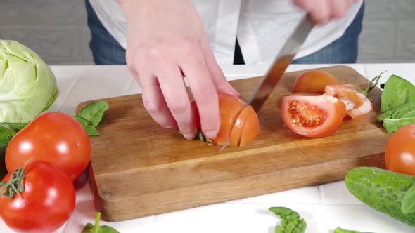 Close-up video of cutting tomatoes