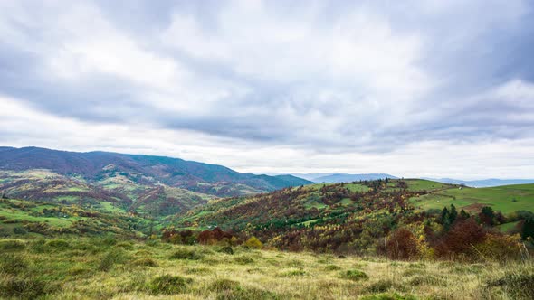 Landscapes of Green Hills Under a Layer of White and Fluffy Clouds alt