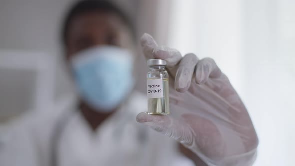 Closeup Covid19 Vaccine Jab with Male Hand Showing Syringe with Liquid Preventive Drug alt