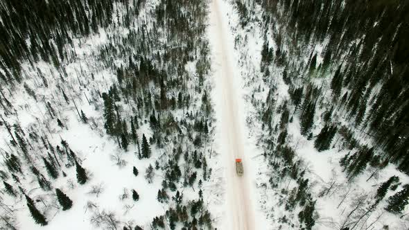 Car Rides by Road in Snow-Covered Forest