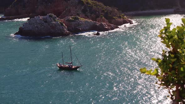 Tourist pirate ship passes treacherous Knysna Heads on a very calm day alt