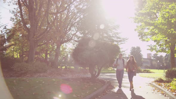 College students on campus walk to meet group