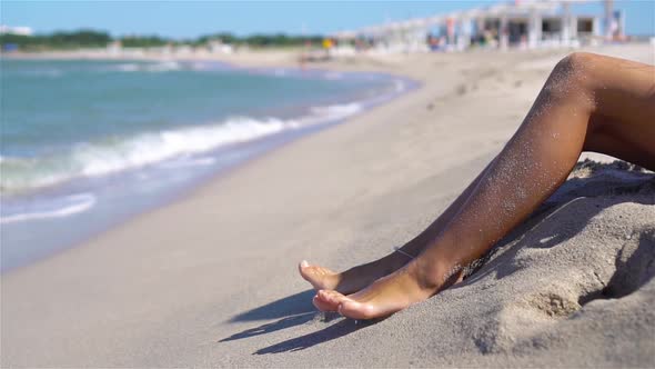 Woman Legs Closeup at Beach During Summer Vacation