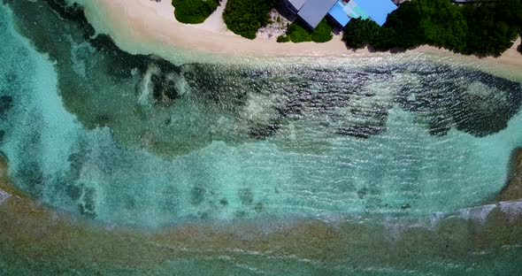 Wide angle drone abstract view of a summer white paradise sand beach and blue ocean background in 4K alt