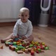 Happy Newborn Baby In Playing Room 