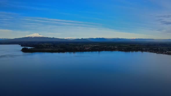 Aerial view of Lake Llanquihue in Puerto Varas, Chile and the Calbuco Volcano alt