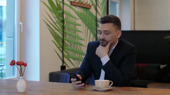 Businessman Using Smartphone alt