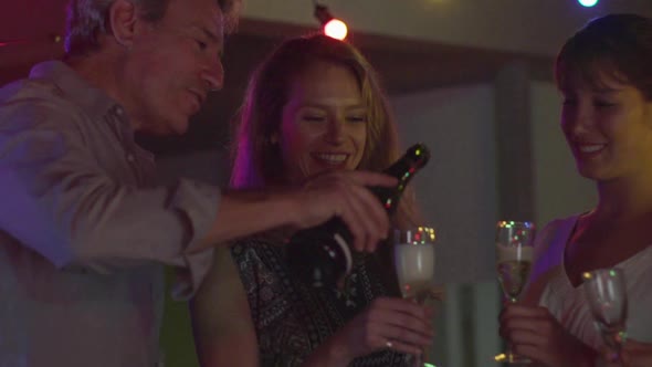 Friends having champagne together alt