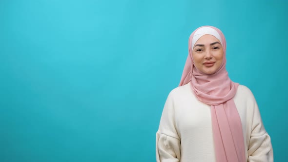 Arab Muslim Woman in Traditional Hijab Looking Straight to Camera and Smiling