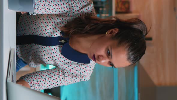 Vertical Video Businesswoman Napping on Chair Waking Up Working on Laptop alt