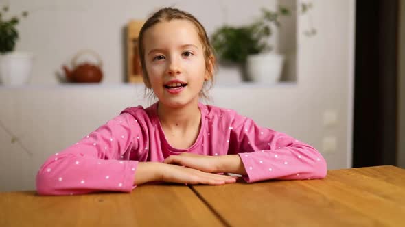 Emotional school girl vlogger speaking by video call blog talking
