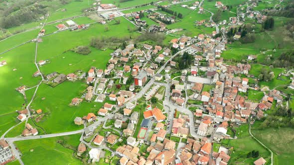 Aerial Video of the Small Town of Pasturo in Lombardy North Italy Showing Mountain Panorama Forest alt