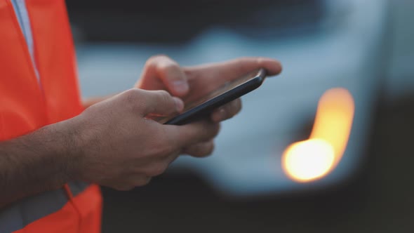Man is Using the Phone in Asking for Help When His Electric Car is Broken alt