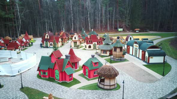 Park in Forest With Wooden Statues of Gnomes, Monsters.  Aerial View of the Wooden Castle 4K Video alt