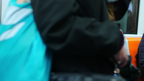 covid19, transport - couple wearing mask talk sitting on the subway alt