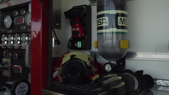 Panning view from Oxygen tanks to Firemen alt