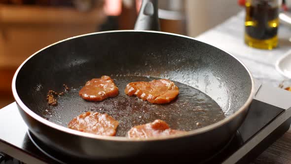 Herb Falls on Meat Pieces. alt