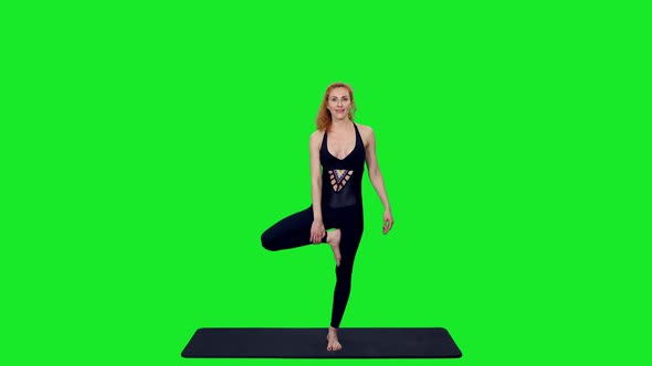 Beautiful Sporty Woman Doing Yoga Against Green Screen Background