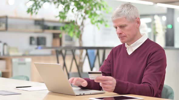 Old Businessman Having Online Payment Failure on Laptop alt